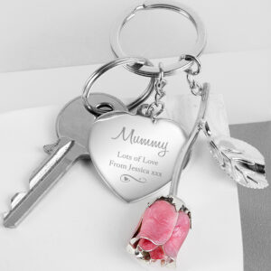 Silver Plated Swirls & Hearts Pink Rose Personalised Keyring This Personalised Swirls & Hearts Pink Rose Keyring is a suave and sophisticated gift for her! This keyring can be personalised with a name up to 12 characters and 2 lines of text, with up to 20 characters per line. All personalisation is case sensitive and will appear as entered. Please avoid entering the name in block capitals, as this may make it difficult to read. The keyring is presented in a black box, with a clear plastic front. This item is silver plated. Ideal for Valentine's Day, Mother's Day, Birthdays. Please double check your personalisation as how it appears here will be how it appears on the product, including spacing and punctuation. Please do not include accents and special symbols as some of our processes will not allow this. Despatched within 1-3 Days of order, Available for Next Day Dispatch Height 14.5 cm Width 3.2 cm Depth 1.2 cm