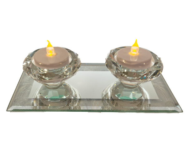 A pair of glass tea light on a glass tray. JD56786