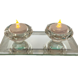 A pair of glass tea light on a glass tray. JD56786